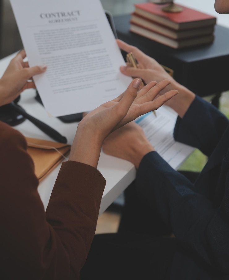 Contract documents on a desk